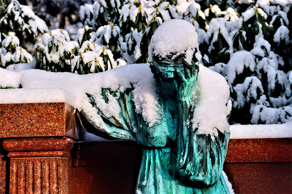 statue snow sad